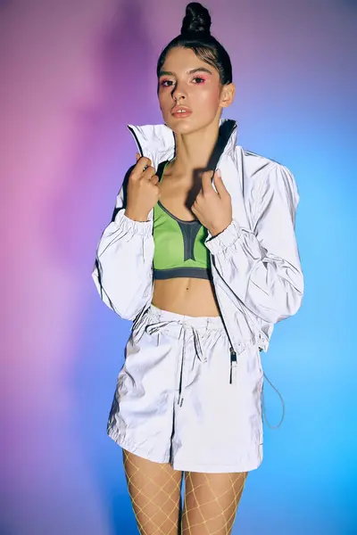 A confident young woman displays her modern style against a colorful backdrop. — Stock Photo