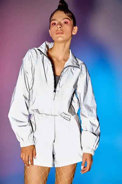 A confident woman in stylish attire stands out against a vibrant holographic backdrop. — Stock Photo