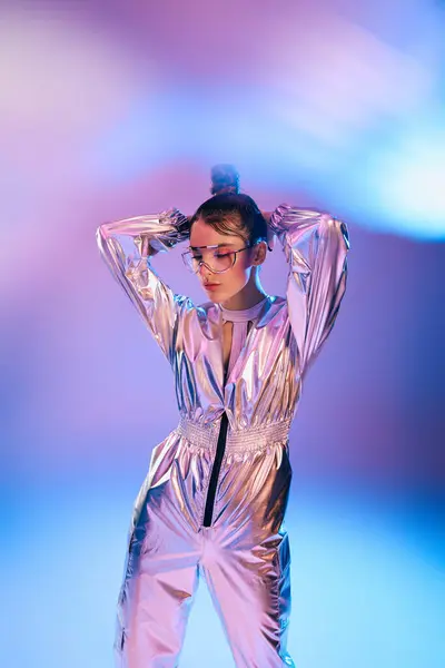 A young woman in metallic attire poses confidently, embodying modern fashion trends and style. — Stock Photo