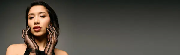Young stylish woman poses confidently while exploring unique fashion in an artistic environment — Stock Photo