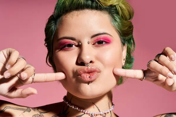 Confident young woman with colorful makeup and stylish accessories poses playfully, exuding charm. — Stock Photo