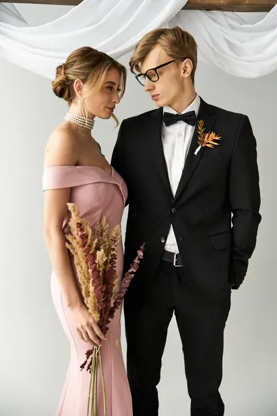 A young couple shares an intimate moment at their spring wedding, showcasing elegance and joy. — Stock Photo