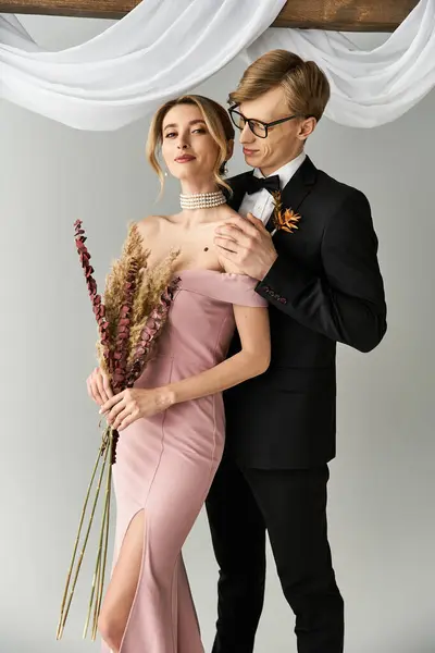 Young couple embraces their love during a beautiful spring wedding, filled with joy and elegance. — Stock Photo