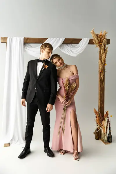 A young couple celebrates their love in spring at a wedding adorned with elegant decorations. — Stock Photo