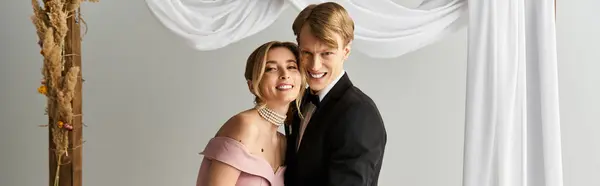 A young couple beams with happiness as they embrace during their spring wedding day, banner — Stock Photo