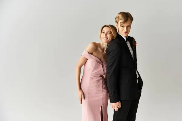 A couple enjoys their wedding day, radiating love and happiness in beautiful spring attire. — Stock Photo