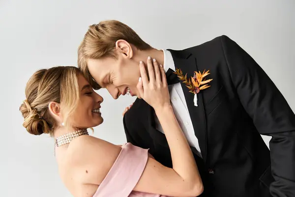 A young couple shares an intimate moment during their spring wedding celebration. — Stock Photo