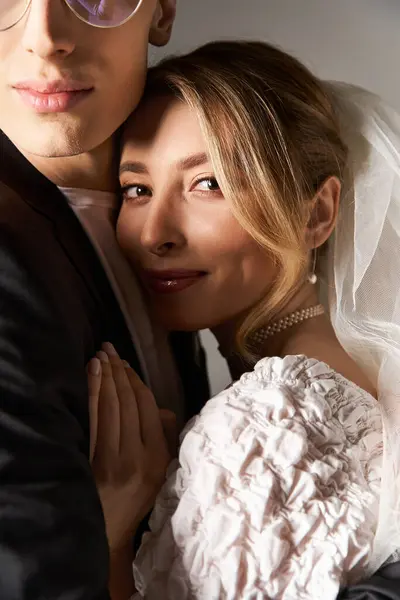 A delighted couple shares a tender moment, dressed elegantly for their spring wedding ceremony. — Stock Photo