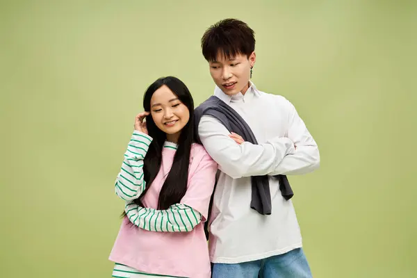 A stylish couple enjoys a cozy moment, highlighting their fashion and playful vibe. — Stock Photo