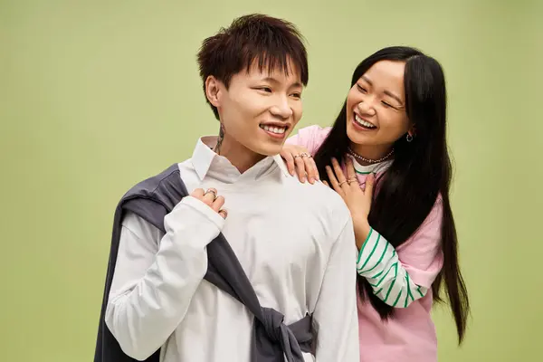 A charming couple shows off their style and love, smiling and enjoying each other. — Stock Photo