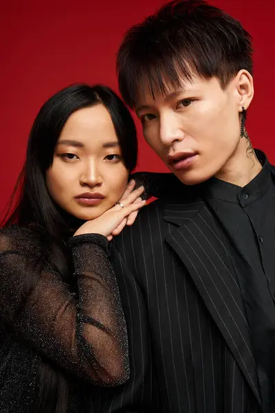 A couple embraces, showcasing their unique fashion and illuminating love and connection. — Stock Photo