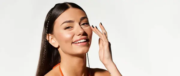 Young woman embraces summer with a glowing tan and joyful smile while applying sunscreen, banner — Stock Photo
