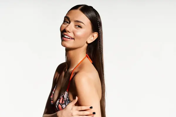 A young woman with a sun-kissed glow smiles brightly while basking in summer warmth. — Stock Photo