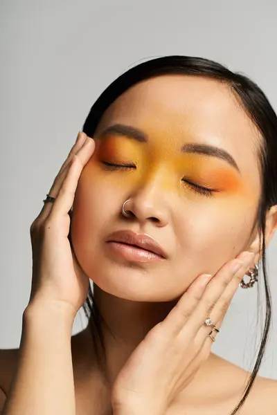 Bright colors showcase a young Asian womans beauty and creativity in artistic expression. — Stock Photo
