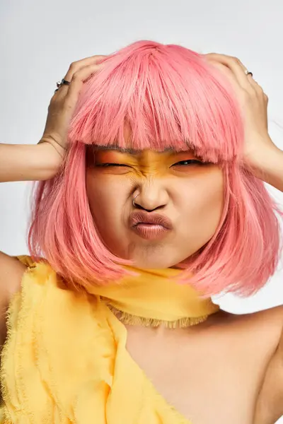 Brightly colored hair and makeup highlight a young asian womans playful and expressive demeanor. — Stock Photo