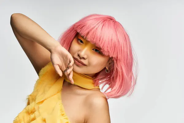 A young woman with pink hair showcases her unique style and cheerful demeanor. — Stock Photo