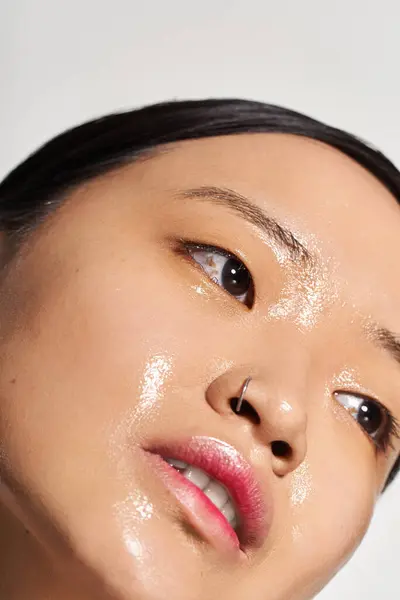 Close up of a radiant young Asian woman showcasing her charming facial features. — Stock Photo