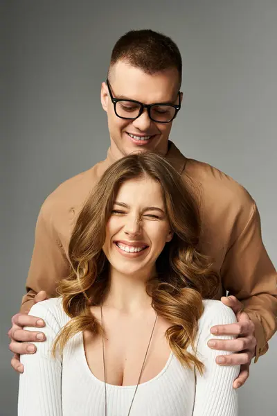 A beautiful bride and groom share a moment of happiness, embracing each other with love and joy. — Stock Photo