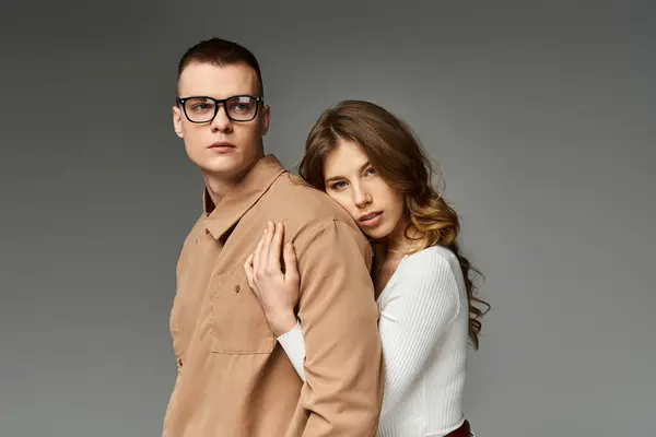 A young couple shares deep affection in a stylish, elegant setting. — Stock Photo