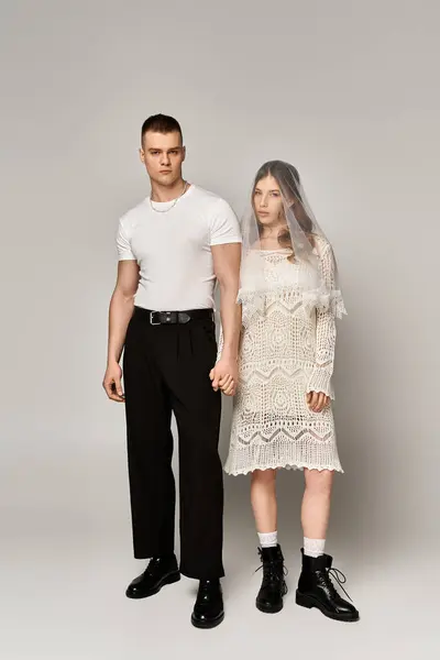 A beautiful couple stands together, showcasing elegance and deep affection in a serene setting. — Stock Photo