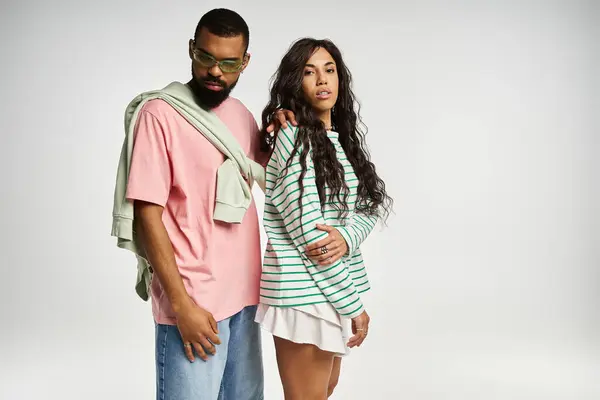 Couple expresses love and style while posing in a trendy, minimalist indoor space — Stock Photo