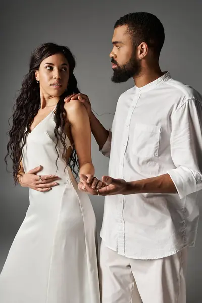 Couple showcases their stylish looks and deep connection in an intimate moment together. — Stock Photo