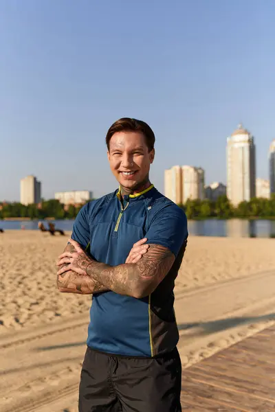 A young man strolls happily by the riverside, showcasing his bright smile and stylish attire. — Stock Photo