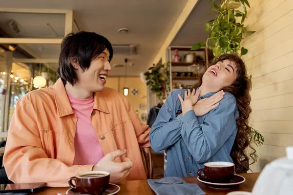 Two multicultural friends enjoy each other's company at a vibrant cafe, sharing heartfelt moments. — Stock Photo