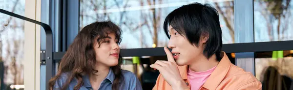 Two young multicultural friends enjoy each others company while chatting in a cozy cafe, banner — Stock Photo