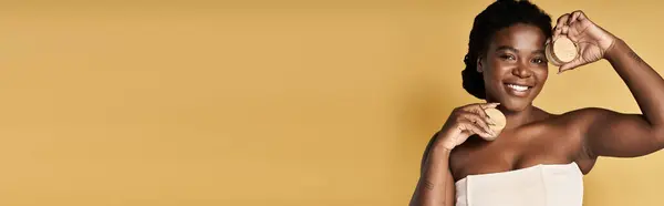 Young African American woman showcases her beautiful skin while promoting skincare in a studio, banner — Stock Photo
