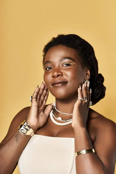 Young woman with radiant skin showcases beauty and confidence against a vibrant backdrop. — Stock Photo