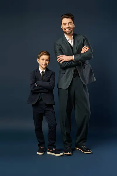 A happy father and son, both elegantly dressed, celebrate fatherhood together. — Stock Photo