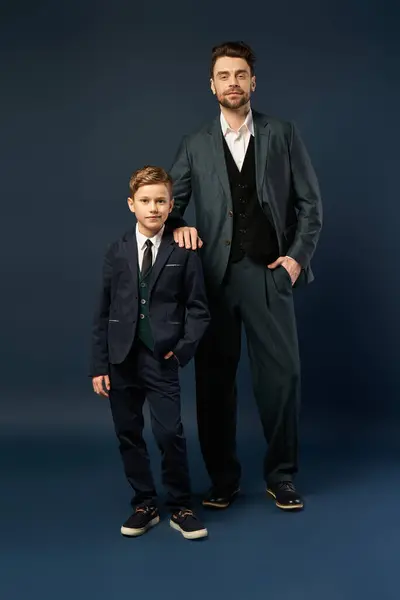 Father and son stand proudly together, embodying love and togetherness on a festive day. — Stock Photo