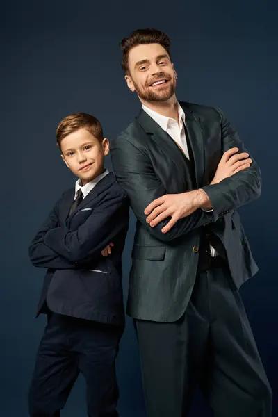 A father and son joyfully pose in formal attire for Fathers Day. — Stock Photo
