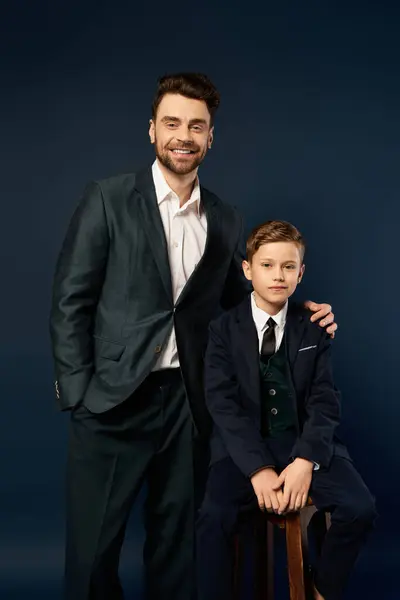 A joyful father and son pose together, showcasing a heartfelt bond and elegance. — Stock Photo