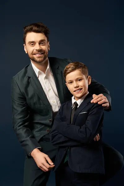 A father and son pose happily in formal attire, celebrating Fathers Day together. — Stock Photo