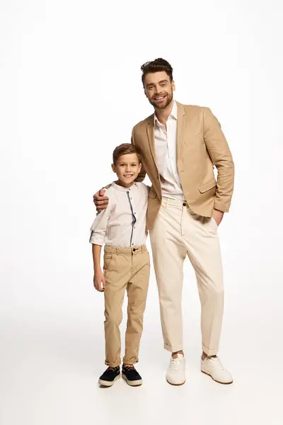 Father and son share a joyful moment in festive outfits for Fathers Day. — Stock Photo