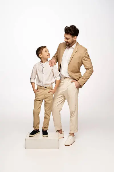 A joyful father and son share a special moment, showcasing love and connection on Fathers Day. — Stock Photo