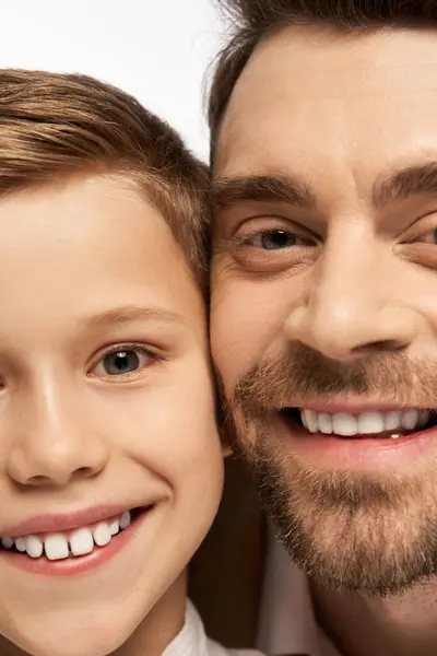 A joyful father and son smile together, enjoying their special bond on Father Day in 2025. — Stock Photo