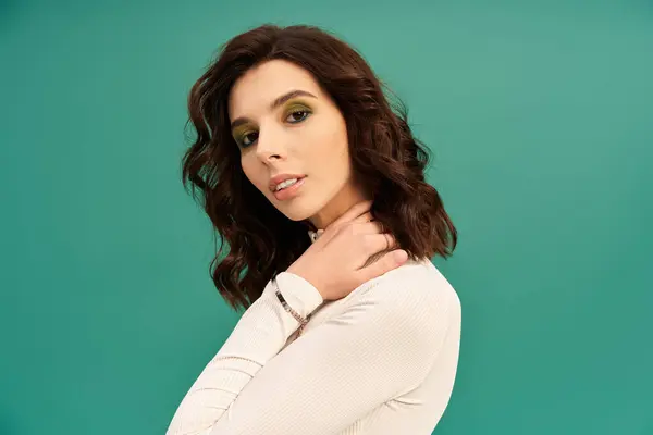 Young woman showcases trendy sporty fashion while posing gracefully in the studio. — Stock Photo
