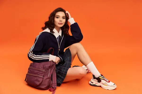 Young woman poses elegantly in fashionable skirt and jacket, radiating style and confidence. — Stock Photo