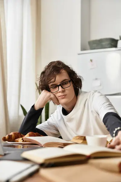 Cozy atmosphere highlights a young mans relaxed afternoon coffee and reading experience. — Stock Photo