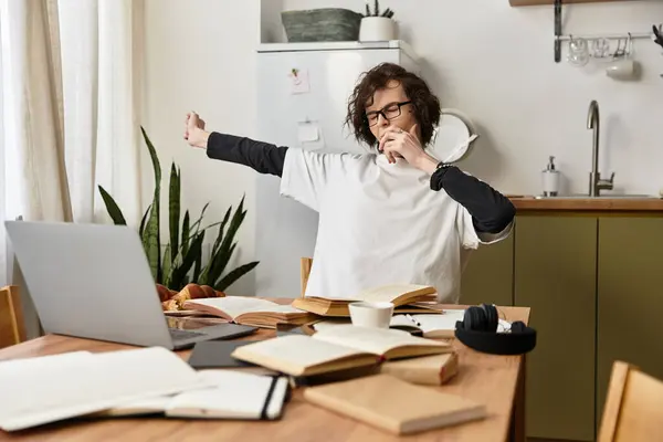 Young man stretches and feels at ease in a cozy home setting filled with books and greenery. — Stock Photo