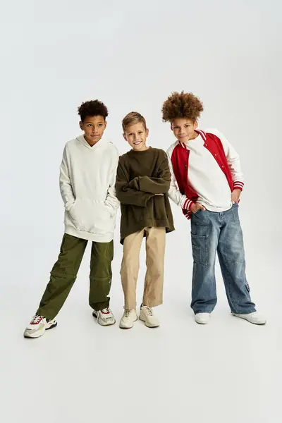 Adorable little boys wear colorful outfits, celebrating their friendship and playful spirit. — Stock Photo