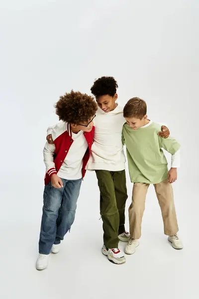 Joyful boys celebrate friendship in colorful outfits, creating lasting memories together. — Stock Photo