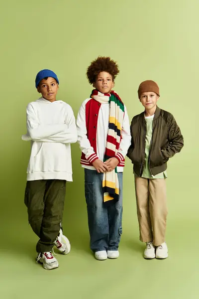 Three adorable little boys showcase their friendship while sporting trendy, colorful attire. — Stock Photo