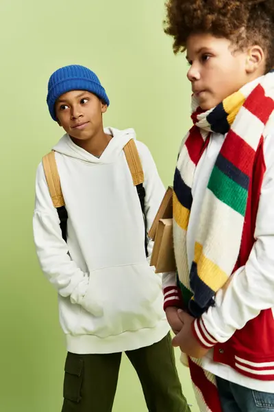 Two adorable boys dressed in fashionable attire share a joyful moment full of friendship. — Stock Photo