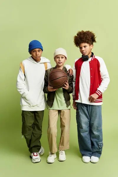 Three cute boys in trendy outfits, united by their friendship and love for basketball. — Stock Photo
