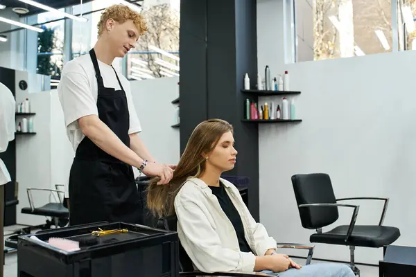 A stylist carefully styles a clients hair in a chic beauty salon filled with vibrant energy. — Stock Photo