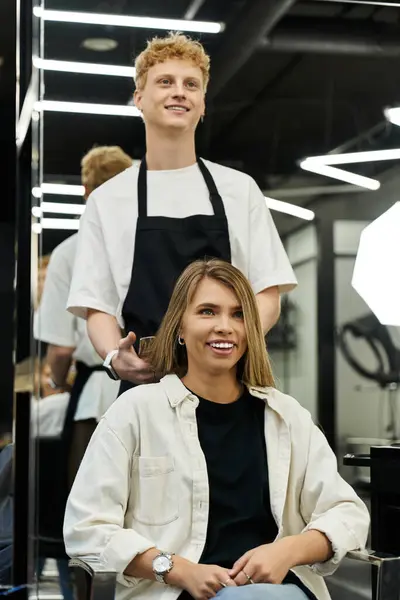 Stylists and clients interact in a lively salon featuring the latest fashion and hairstyles. — стокове фото